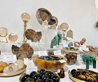 Shop interior featuring gemstones, healing crystals, and spiritual products