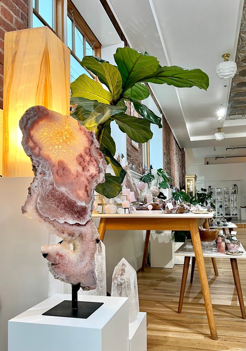 Collection of tumbled stones, raw minerals, and crystal clusters