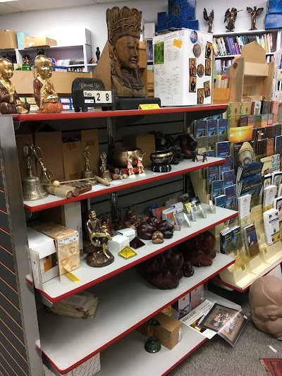 Retail shelving with organized crystals, stones, and spiritual products