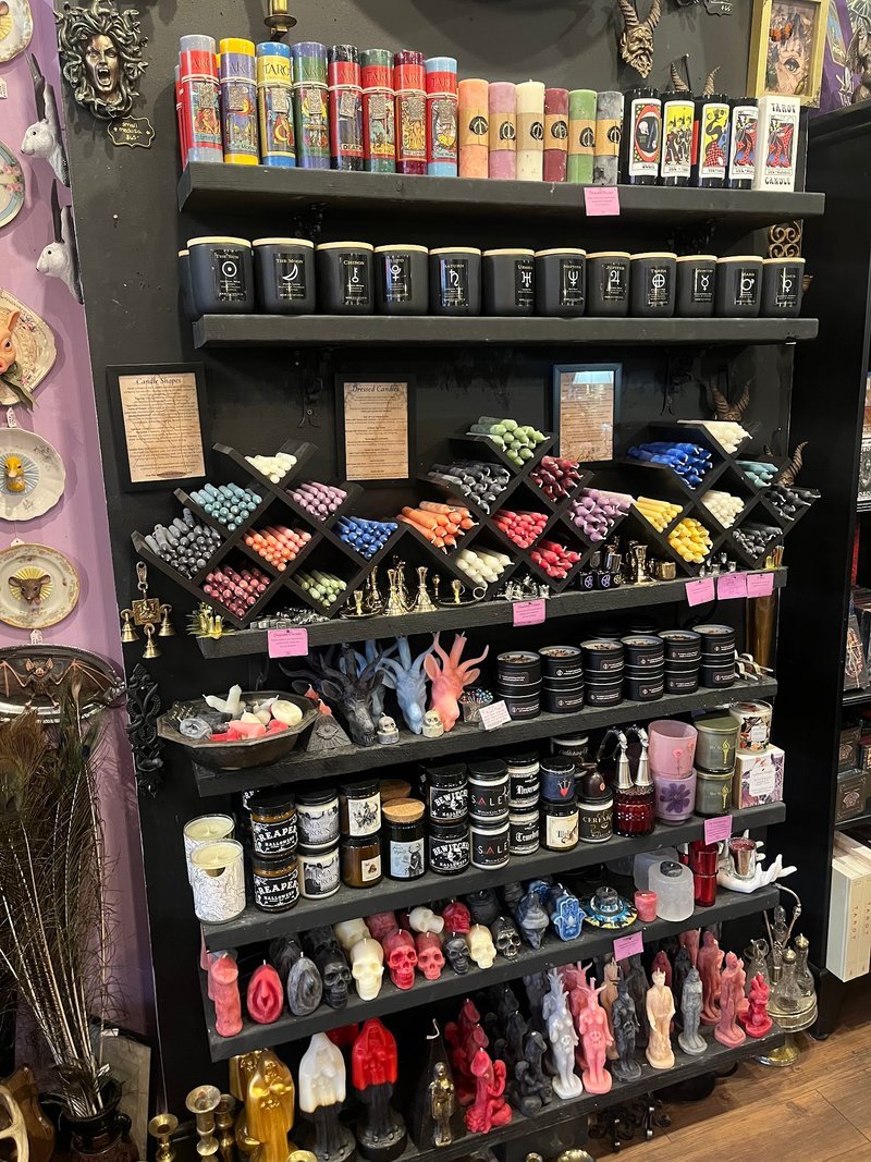 Display featuring crystal points, polished stones, and raw mineral specimens