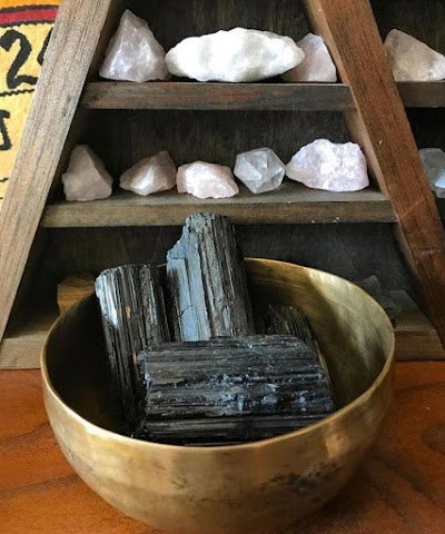 Retail display with tumbled stones, raw crystals, and polished specimens
