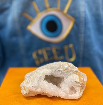 Variety of gemstones, crystal carvings, and polished mineral specimens