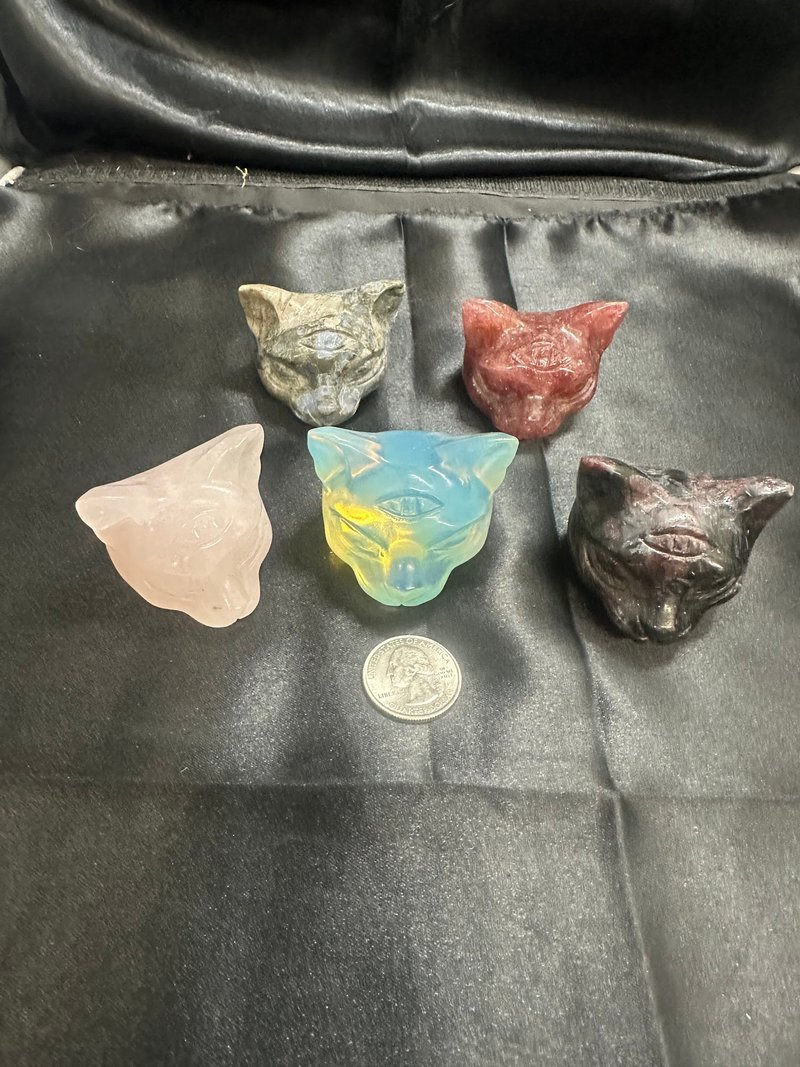 Display featuring crystal points, polished stones, and raw mineral specimens