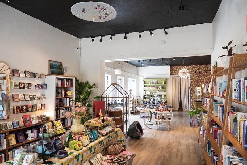 Display featuring crystal points, polished stones, and raw mineral specimens