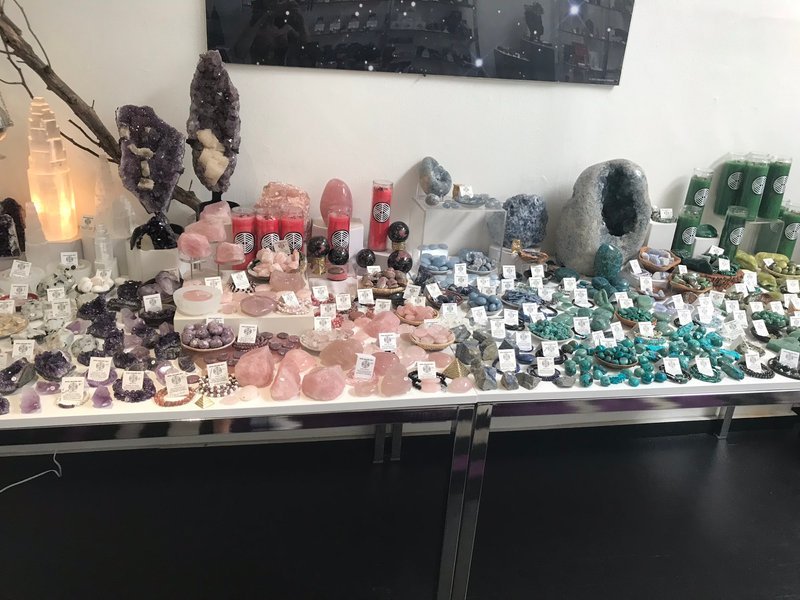 Crystal and mineral specimens including quartz, amethyst, and calcite varieties