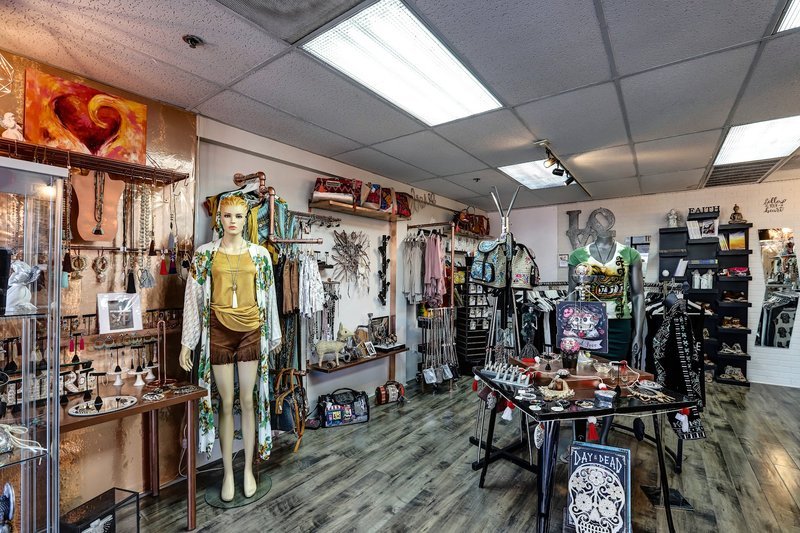 Retail shelving with organized crystals, stones, and spiritual products