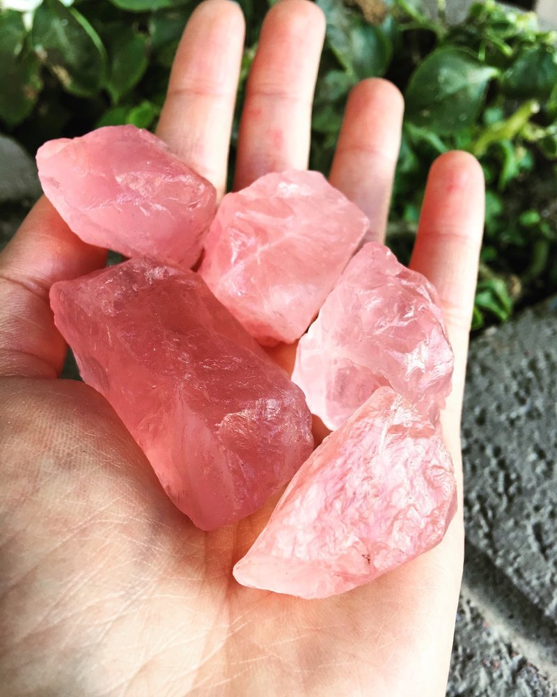 Selection of healing crystals, tumbled stones, and decorative mineral pieces