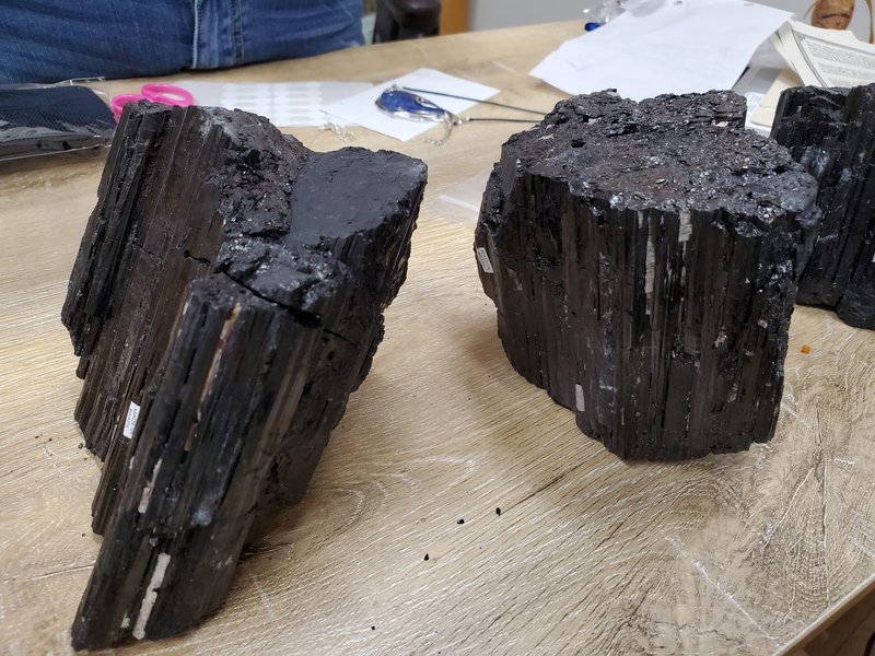 Collection of tumbled stones, raw minerals, and crystal clusters