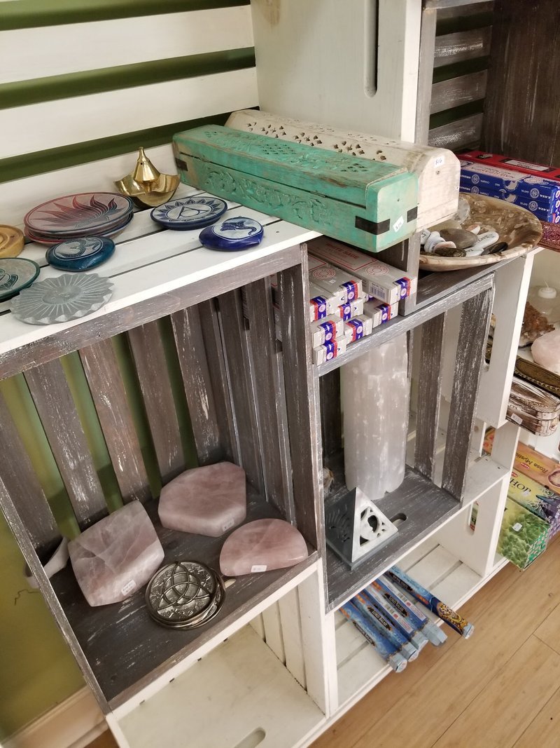 Variety of gemstones, crystal carvings, and polished mineral specimens