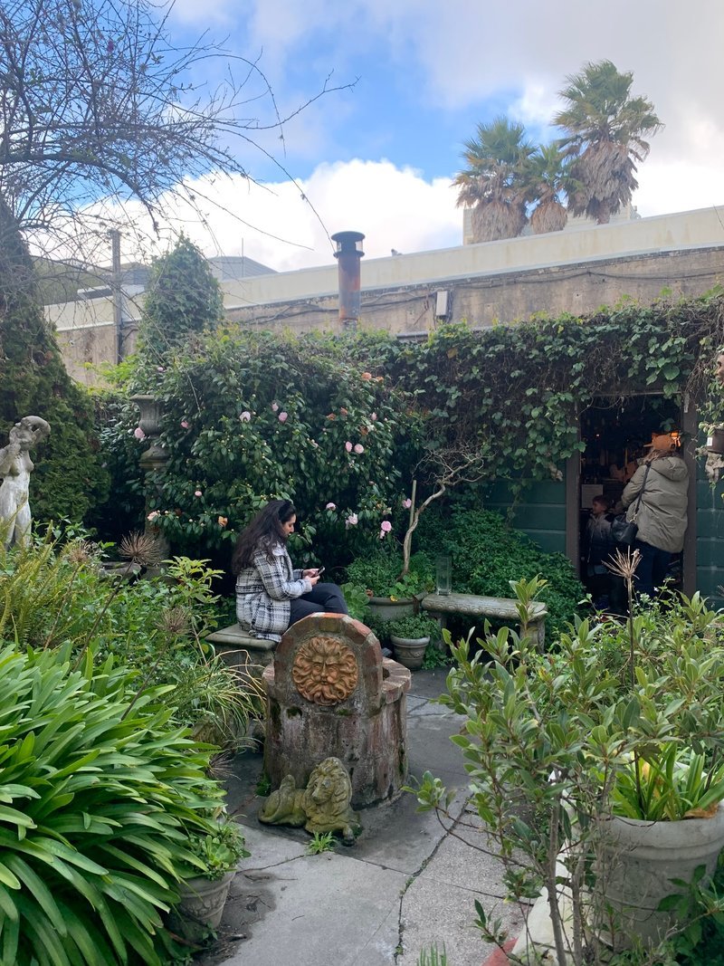 Retail shelving with organized crystals, stones, and spiritual products