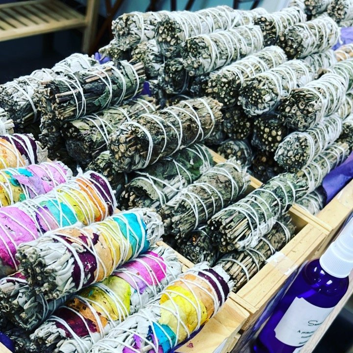 Display featuring crystal points, polished stones, and raw mineral specimens