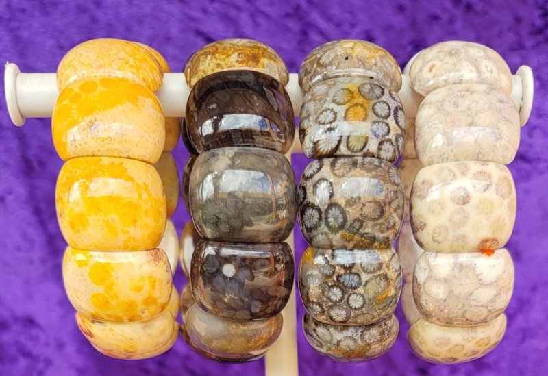 Collection of tumbled stones, raw minerals, and crystal clusters