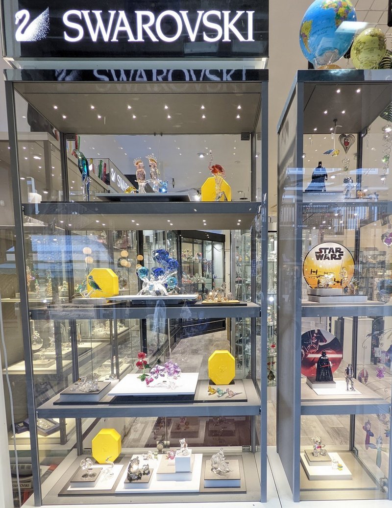 Organized crystal display with labeled stones and healing minerals