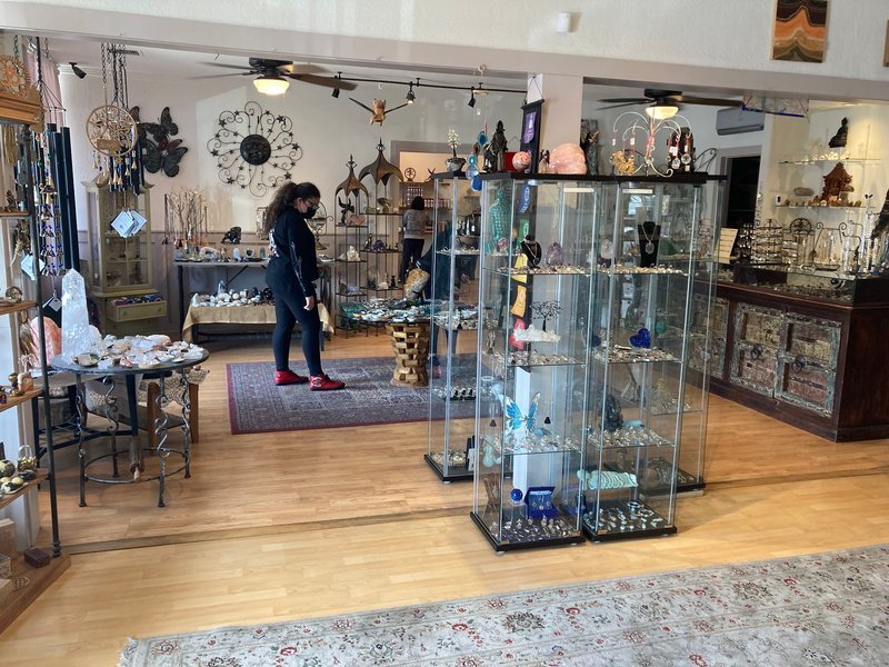 Store interior displaying crystals, minerals, and metaphysical supplies