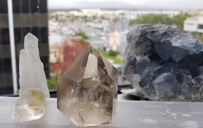 Organized crystal display with labeled stones and healing minerals
