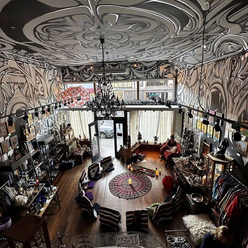 Shelving display featuring amethyst, quartz, and various crystal specimens
