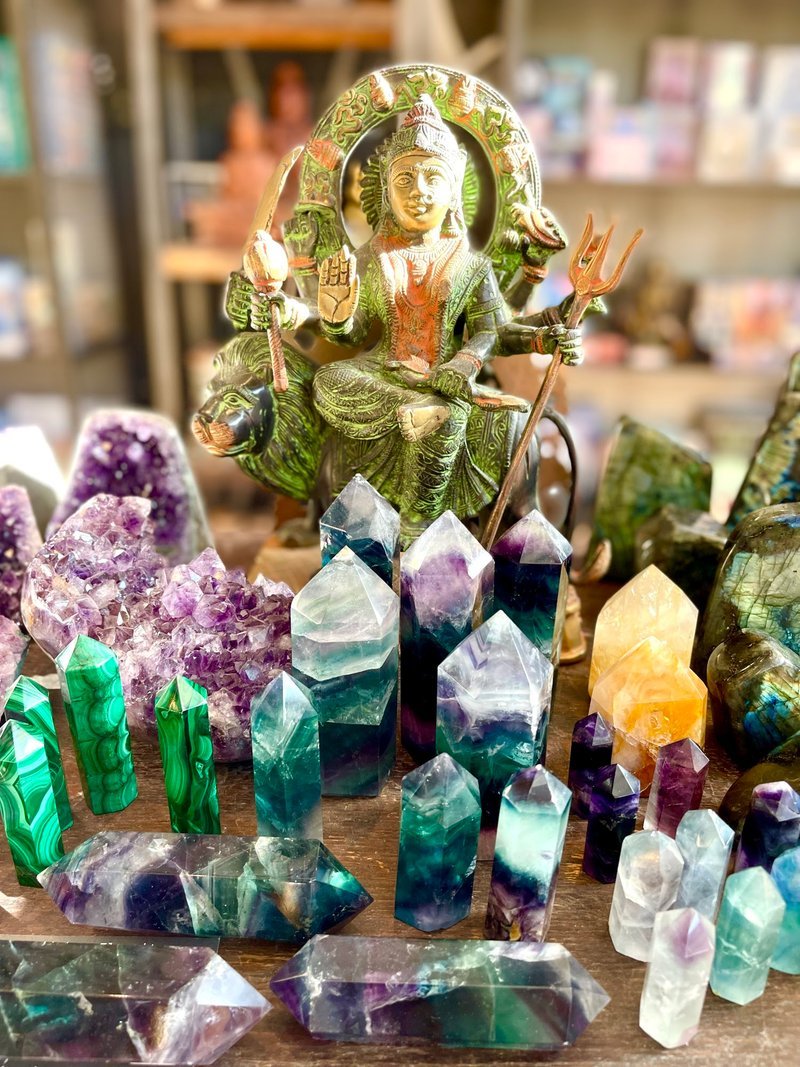 Selection of healing crystals, tumbled stones, and decorative mineral pieces