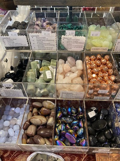 Retail display with tumbled stones, raw crystals, and polished specimens