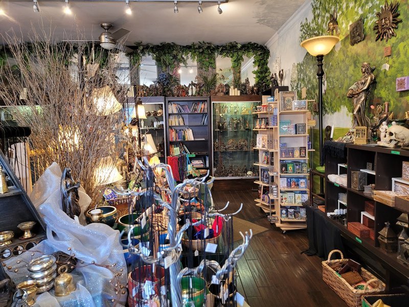 Variety of gemstones, crystal carvings, and polished mineral specimens