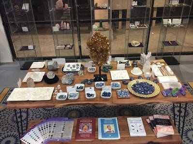 Crystal and mineral specimens including quartz, amethyst, and calcite varieties