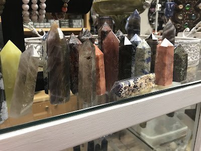 Retail display with tumbled stones, raw crystals, and polished specimens