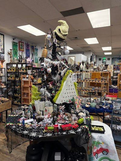 Shelving display featuring amethyst, quartz, and various crystal specimens