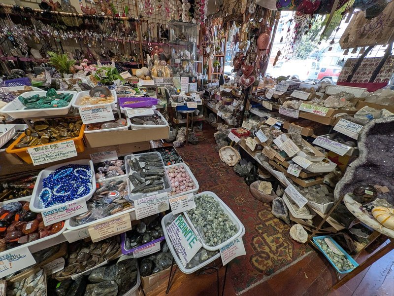 Retail display with tumbled stones, raw crystals, and polished specimens