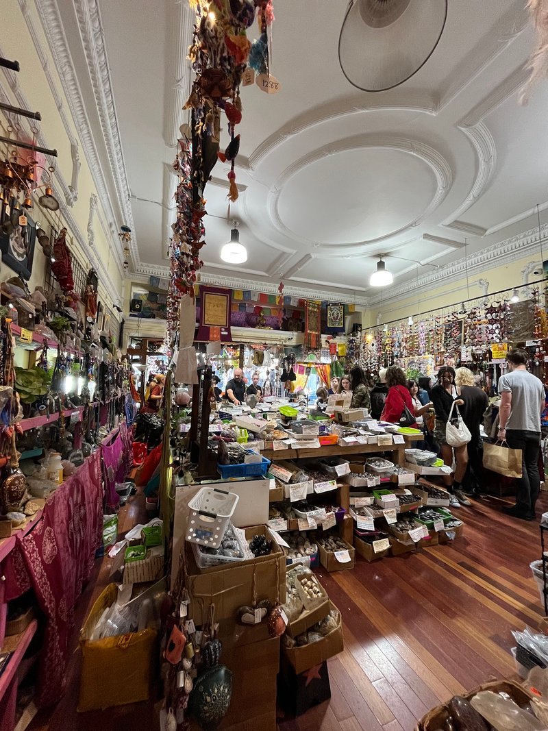 Variety of gemstones, crystal carvings, and polished mineral specimens