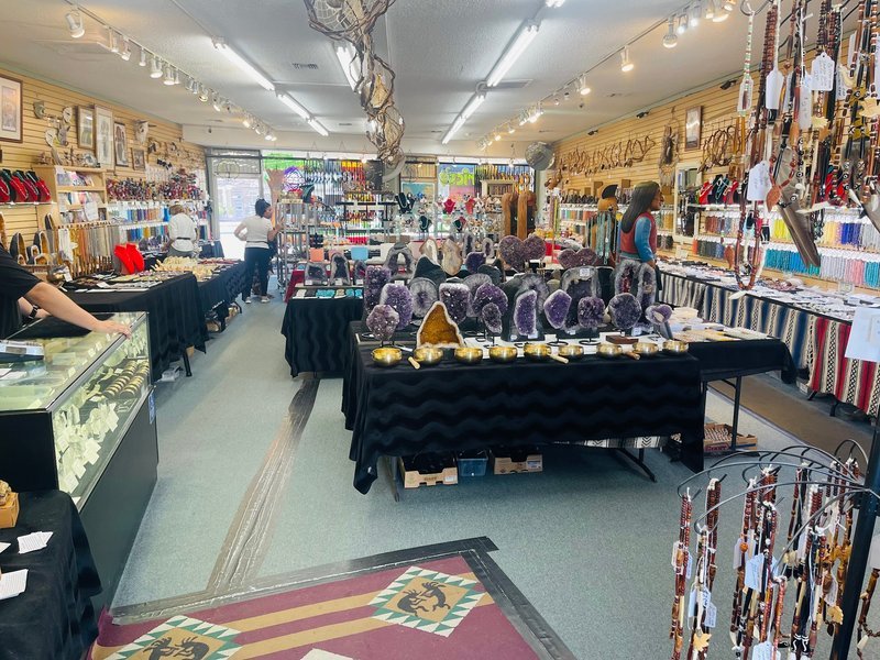 Shop interior featuring gemstones, healing crystals, and spiritual products