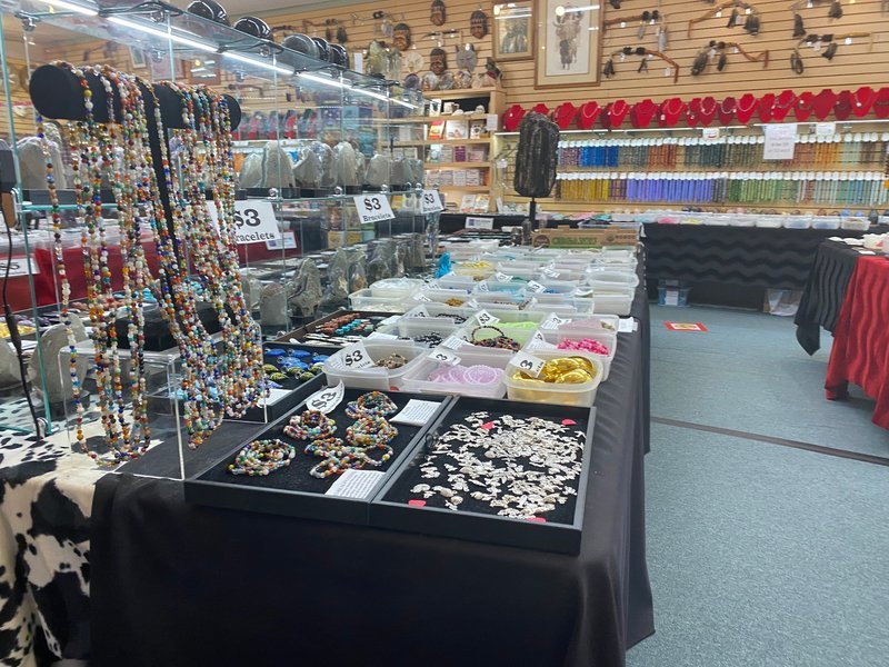 Display of polished crystal specimens, geodes, and mineral towers