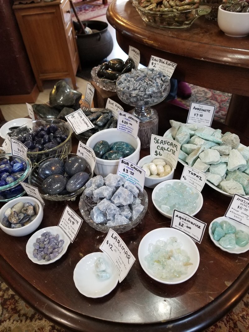 Shop interior featuring gemstones, healing crystals, and spiritual products