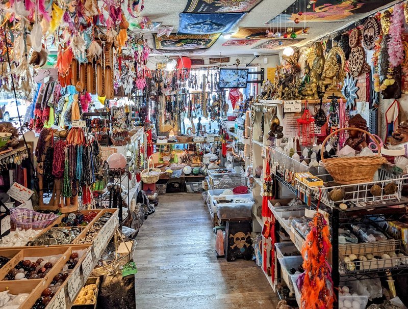 Retail display with tumbled stones, raw crystals, and polished specimens