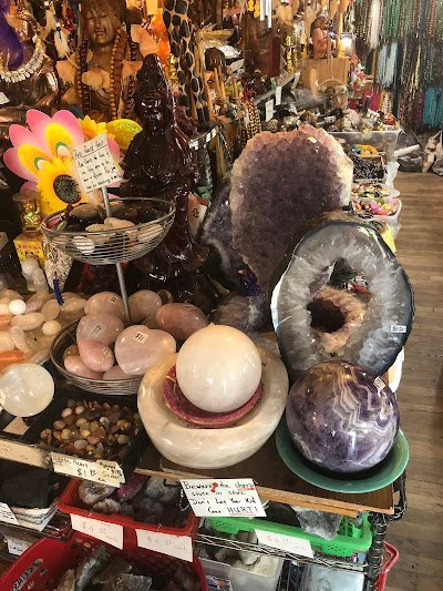 Selection of healing crystals, tumbled stones, and decorative mineral pieces