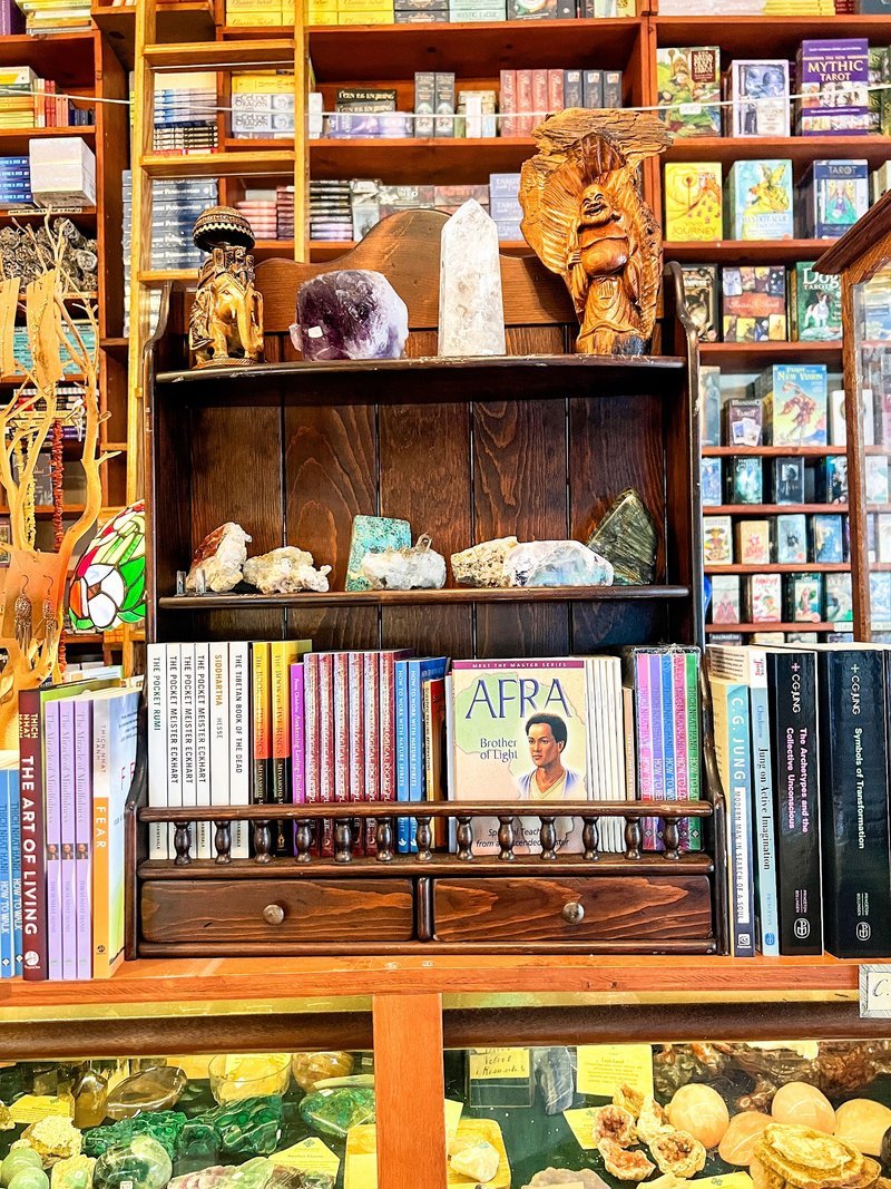 Collection of tumbled stones, raw minerals, and crystal clusters