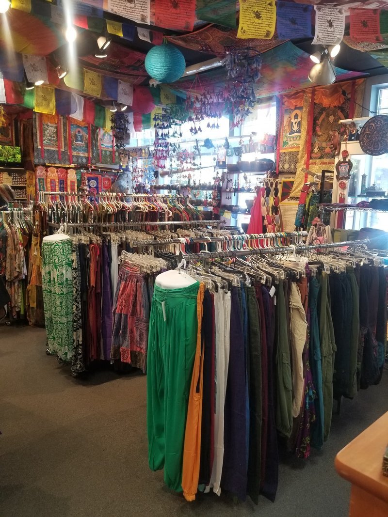 Shelving display featuring amethyst, quartz, and various crystal specimens