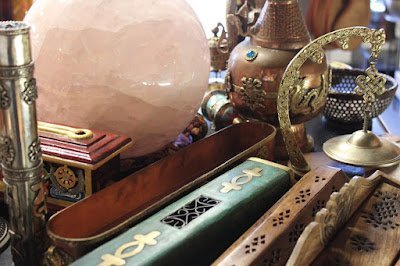 Variety of gemstones, crystal carvings, and polished mineral specimens