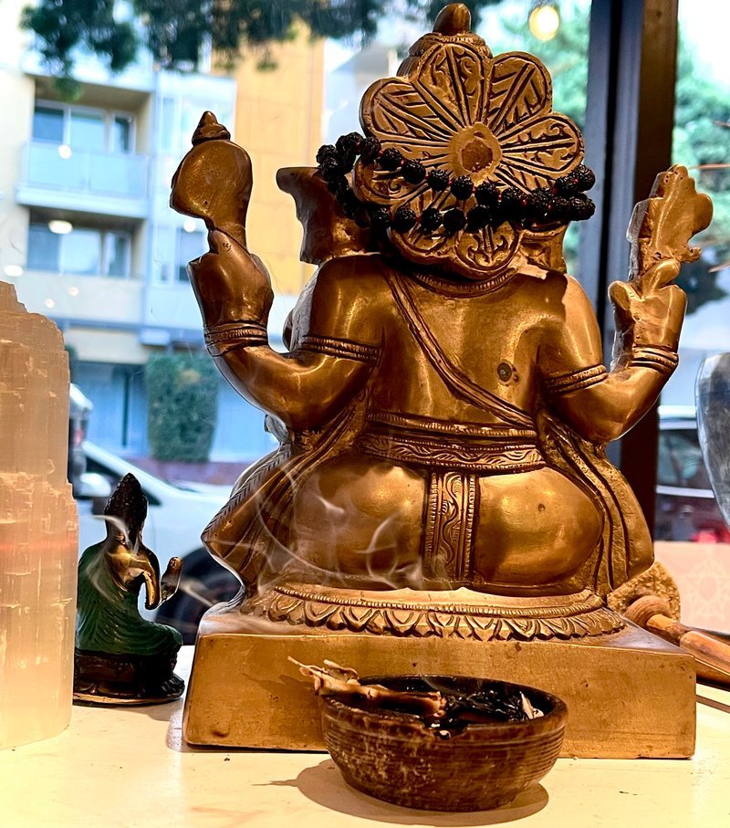 Retail shelving with organized crystals, stones, and spiritual products