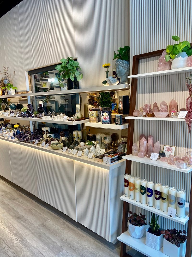 Display of polished crystal specimens, geodes, and mineral towers