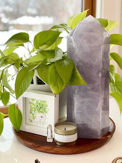 Crystal specimens and minerals displayed with spiritual and metaphysical items