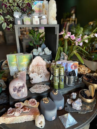 Shelving display featuring amethyst, quartz, and various crystal specimens