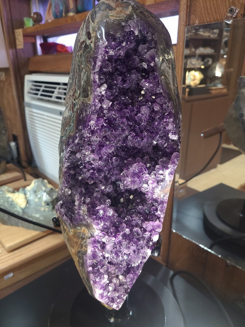 Shop interior featuring gemstones, healing crystals, and spiritual products