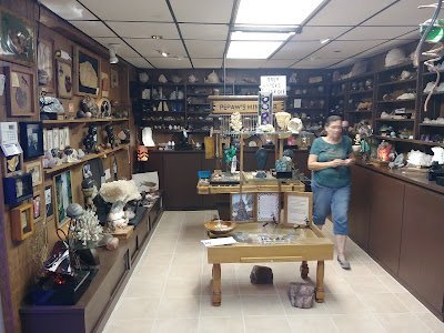 Retail shelving with organized crystals, stones, and spiritual products
