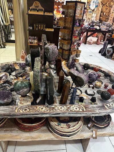 Retail display with tumbled stones, raw crystals, and polished specimens